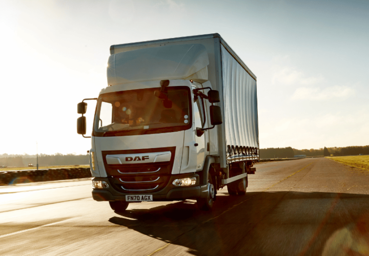 daf lorry driving on a road using microlise transport management system (TMS)